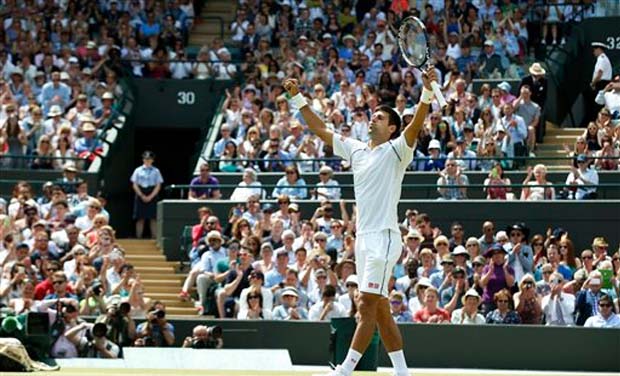 Novak Djokovic of Serbia celebrates winning the singles match against Kevin Anderson of South Africa, at the All England Lawn Tennis Championships in Wimbledon, London. Djokovic won 6-7, 6-7, 6-1, 6-4, 7-5 (Photo: AP) Novak Djokovic of Serbia celebrates winning the singles match against Kevin Anderson of South Africa, at the All England Lawn Tennis Championships in Wimbledon, London. Djokovic won 6-7, 6-7, 6-1, 6-4, 7-5 (Photo: AP)